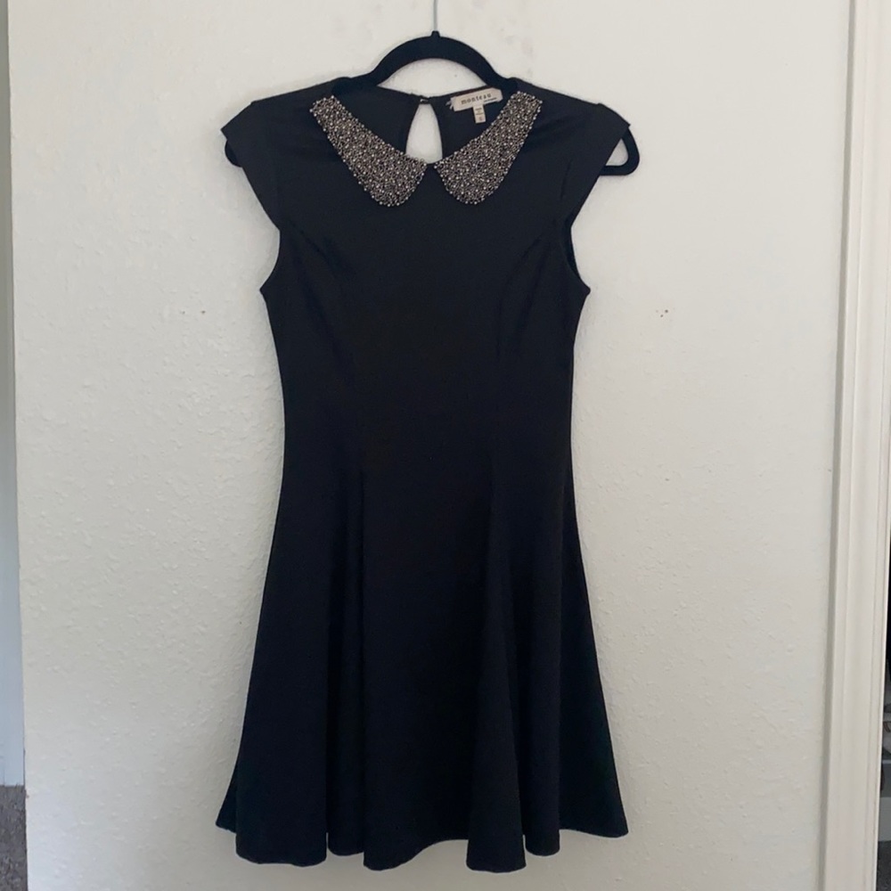Selling black dress with beaded collar